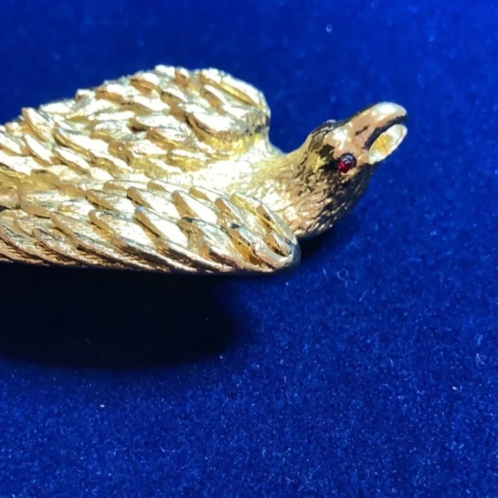 Vintage ‘60s gold tone Nesting eagle with red rhinestones